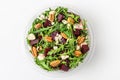 Plastic package with healthy salad made of beet or beetroot, arugula, blue cheese and pecan nuts to take away Royalty Free Stock Photo