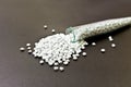 Plastic pellets. White Colorant for plastics, in test-tube again Royalty Free Stock Photo