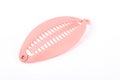 Plastic pink banana hair clip. Royalty Free Stock Photo