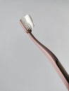 Plastic pink toothbrush with paste for daily morning oral care. Royalty Free Stock Photo