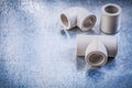 Plastic pipe connectors on metallic surface construction concept Royalty Free Stock Photo