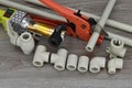 Plastic pipe welder. Components making water pipes and special scissors for cutting plastic water pipes.