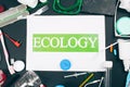 Plastic pollution concept. Save marine ecology. Paper with word Ecology in the center of colorful single-use plastic Royalty Free Stock Photo