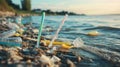 Plastic Pollution on a Sandy Beach Shoreline Royalty Free Stock Photo