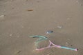 Plastic racket sea pollution on sandy beach ecosystem,garbage on sea coast Royalty Free Stock Photo