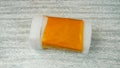 Plastic/polyetylene foam covered with orange adhesive tape - forming a package with lid Royalty Free Stock Photo