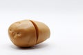 a plastic potato on a white background