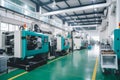 A plastic production plant with workers operating injection molding machines to manufacture plastic products Royalty Free Stock Photo