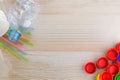 Plastic products on a wooden background: caps, tubes, cups, package, bottle Royalty Free Stock Photo