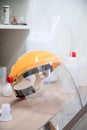 Plastic protective face shield preparing for use in operating room in hospital. Chemical protective mask in lab