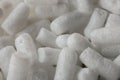 Plastic protective foam background and texture. Macro view of white packing foam background. Bubbly plastic protective granules. Royalty Free Stock Photo