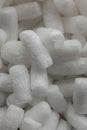 Plastic protective foam background and texture. Macro view of white packing foam background. Bubbly plastic protective granules. Royalty Free Stock Photo