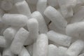 Plastic protective foam background and texture. Macro view of white packing foam background. Bubbly plastic protective granules.