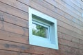 Plastic PVC window in new modern passive wooden house facade wall