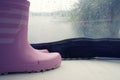 Plastic rain boots pink color on white floor Royalty Free Stock Photo