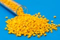 Plastic raw materials in granules for industry.Yellow Polymer on Royalty Free Stock Photo