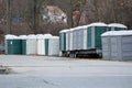 Collection of porta potties in parking lot