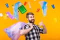 Plastic recycling problem, ecology and environmental disaster concept - Funny man carries garbage for recycling and Royalty Free Stock Photo