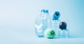 Plastic recycling and reuse concept. Empty plastic bottle and polyester fiber synthetic thread on a blue background. Royalty Free Stock Photo