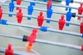 Plastic red and blue football players on table. Royalty Free Stock Photo