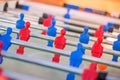 Plastic red and blue football players on table. Royalty Free Stock Photo