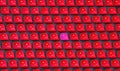 Plastic red and one pink seats on football stadium Royalty Free Stock Photo