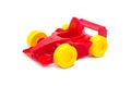 Plastic red racing toy car toy with yellow wheels Royalty Free Stock Photo