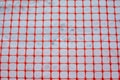 Plastic red safety net for construction site. Fencing repair work Royalty Free Stock Photo