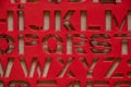 plastic red stencil with english letters as background Royalty Free Stock Photo