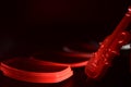 Plastic red toy guitar on a dark surface unique photo Royalty Free Stock Photo