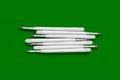 Plastic refills for ballpoint pens. Refills for a ballpoint pen. White ink refills on a green Royalty Free Stock Photo