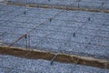 Plastic reinforcement fixers.  Iron wire mesh for concreting floors of buildings. Royalty Free Stock Photo