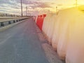 Plastic road barriers filled with red and white water Royalty Free Stock Photo