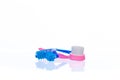 Plastic roller massager and soft bristle brush to stimulate skin blood