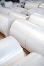 Plastic rolls stored in rows at factory warehouse