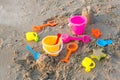 Plastic sandbox toys on the sand. kids toys on tropical sand beach. Plastic shovel and sea animal mold toys on sand. Favorite toys