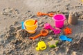 Plastic sandbox toys on the sand. kids toys on tropical sand beach. Plastic shovel and sea animal mold toys on sand. Favorite toys Royalty Free Stock Photo