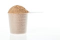 Plastic scoop of chocolate whey isolate protein Royalty Free Stock Photo