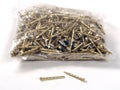 A bag of twisted gold colour nails used for many securing projects-close up