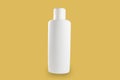 Plastic Shampoo Bottle With Flip-Top Lid. MockUp yellow background Royalty Free Stock Photo