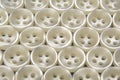 Plastic shiny buttons for clothes on a fabric background. Fashion and clothing. Factory industry