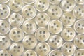 Plastic shiny buttons for clothes. Fashion and clothing. Factory industry Royalty Free Stock Photo