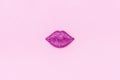 Plastic shiny lips close-up on pink background. Royalty Free Stock Photo