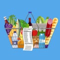 Plastic shopping basket full of groceries products Royalty Free Stock Photo