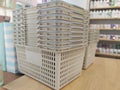 Plastic shopping basket in a self-service store are waiting for customers on the counter.