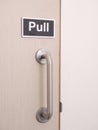 Plastic sign Pull at a door with handle Royalty Free Stock Photo