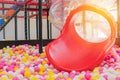 Plastic slide with colourful balls for the kid`s playground Royalty Free Stock Photo