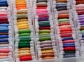 Plastic sorting box full of bobbins with colour embroidery threads Royalty Free Stock Photo