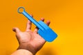 Plastic spatula on orange background Royalty Free Stock Photo