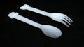 Plastic spoon and fork isolated on black background Royalty Free Stock Photo